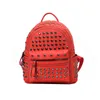 INS Super Hot Rivet Small Backpack Female 2024 새로운 디자이너 학생 미니 학교 주머니 PU 가죽 레저 지갑 아울렛