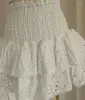 Robes de travail tempérament minoritaire français coton une épaule à volants haut élastique brodé creux mini jupe taille ensemble 2 pièces