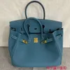 Designer draagtassen Luxe mode Schoudertassen Togo leren tas lychee patroon Modieuze veelzijdige leren handtas met gesp 25 / 30 / 35 / 40cm