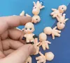 Dolls 50pcs Lot اليابانية الشهيرة كرتون بيبي دمية 3 سم جميلة PVC Kewpie Angel Kids Toys Collection Home Home Decoration 231027