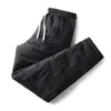 Pantalons pour hommes hiver hommes coton rembourré taille élastique couleur unie épaissie doublure en peluche pantalon résistant au froid pantalons de survêtement à lacets