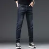 Męski projektant dżinsów Guangzhou Xintang Autumn and Winter Nowy produkt Slim Fit Elastic Feet Koreańskie wydanie Trendy Boys 'Student Pants Little Monster 8EDP