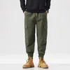 Nowe spodnie męskie pokazują wysokie i cienkie spodnie robocze Mężczyźni Trwałe jesień i zima Wygodne długie bawełniane spodnie Casual Pants Mężczyzn Multi Pocket Leggins