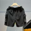 Shorts masculinos calças curtas preto verão macacão solto bolsos cordão reto perna larga high street cinco pontos