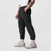 Calças masculinas 2023 primavera outono jogger homens emenda rápida secagem casual esporte zíper bolsos corredores calças de fitness sweatpants