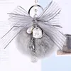 Keychains lyxiga päls pompom fluffig metall båge nyckelring nyckelning diy väska charms handväska hängsmycken tillbehör kvinnor gåva bulk
