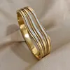 Brazalete AENSOA con incrustaciones de cristal y circonita, brazaletes ondulados de acero inoxidable, pulseras para mujer, diseño único, accesorios de Color dorado