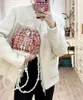 23ss Fashion niche Fall/Winter Backpack Women's Pocket Pearl bucket drawstring Travel Backpack Braided cowhide Bag mini bag