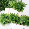 장식용 꽃 도매 100pcs 크리스마스 트리 소나무 가지 인공 가짜 식물 웨딩 홈 거실 장식 DIY 크리스마스 선물