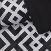 Sängkläder sätter Black Geometric 8 Piece -säng i en väskväst med lakan Queen 231030