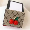 Berömd designer Cherry Purse Luxury Women Mini Card Clip italiensk varumärke Fashion Folding Plånbok Nytt högkvalitativt kreditkortshållare äkta lädermynt Purses Bag