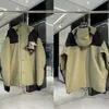 Męska kurtka płaszcza mężczyzn Kobiety kurtki na świeżym powietrzu sportowe ubrania alpinistyczne wiatroodporne tkanina górska para haftowa list zwyczajny z kapturem z xufeng456