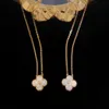 Diseñador de moda 4/Trébol de cuatro hojas V Oro Cuatro Hierbas Abanico dorado Collar de un solo diamante Mujer Fritillaria blanca Ágata roja Colgante clásico 18 Rosa K Cerradura Cadena de hueso