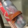 Garrafas de água Gaiolas ODI bicicleta garrafa gaiola retro couro liga de alumínio suporte de copo para montanha estrada dobrável bicicleta iBicycle acessórios 53g 231030