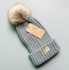 Moda feminina gorro de malha designer quente chapéus de inverno grande pele sintética pom poms bobble chapéu de esqui de malha