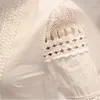 Blouses pour femmes été femmes mince fond à manches longues chemise blanche dentelle crochet fleur creux chemises décontractées Blouse