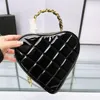 Borsa di design di lusso borsa a tracolla da donna borsa alla moda borsa a tracolla in puro colore con catena a forma di cuore con reticolo di diamanti