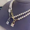 Viviane halsbandsdesigner Viviennes Westwoods Luxury Hip Hop Jewlery Harts Lacker Stereoskopiskt lås Head Pearl Saturn Necklace Ins Ladies Pärled Chain