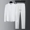 Men's Tracksuits Spring Summer Fashion Suit Men Long Sleeve Casual Shirts And Pant Seersucker Striped Pleats Slim Handsome Twopiece Set 231030