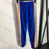 Kvinnors tvåbitar byxor Designer Stripe Patchwork Sport Tracksuits Män Kvinnor Pant mode Långärmad blixtlåsrockar byxor iu8e