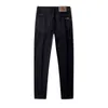 Jeans Gouoi hommes automne et hiver Style coréen Version élastique coupe ajustée petits pieds marque haut de gamme pantalon pur BlackDT3D