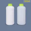 Bottiglie di stoccaggio 1 Pz 1000 ML Bottiglia di Plastica Rotonda Vuota Con Coperchio Contenitore di Materiale HDPE per Uso Alimentare Liquido Riutilizzabile