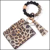 Nyckelringar SIL P￤rlor Key Ring Strands Armband Armband Nyckelring med Cheetah Leopard L￤der Tassel ID -kortpl￥nbok Purse M￤n kvinnor ha Dhmzi