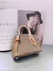 Sac à main design de luxe Mini sac coquillage Togo cuir femme Bowling Bag Messenger Bags