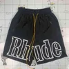 Cinq couleurs disponibles Rhude Shorts pour hommes femmes Oversize Rhude Shorts meilleure qualité jaune cordon respirant Shorts de plage RD22