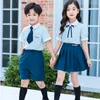 Одежда набор британского стиля детская одежда в начальной школе униформа летние вертикальные полосы рубашка темно -синяя юбка шорты студент
