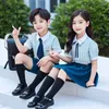 Одежда набор британского стиля детская одежда в начальной школе униформа летние вертикальные полосы рубашка темно -синяя юбка шорты студент
