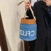 Bolsos Bolso tipo cubo con cordón para mujer, novedad de 2022, vaquero, un solo hombro, cinturón de cuerda con letras, bolso cruzado, monederos