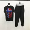 남성용 트랙 슈트 럭셔리 세트 Summe Loose Loose Tracksuit 야간 장면 두개골 브랜드 드릴링 O-Neck 티셔츠 바지 고품질 남성용 짧은 슬리브