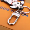 Marque de luxe unisexe porte-clés Dalmatiens chaîne de lettre en métal femmes hommes voiture porte-clés concepteur lettre sac à bandoulière bandoulière fourre-tout P280R