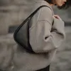 Frauen Luxurys Designer-Taschen High-End-T-R-Leder-Umhängetasche Damen-Achselhöhle Unregelmäßige Mode Tragbarer Halbmond Einfache Hand-Crossbody