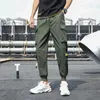 Pantaloni da uomo Tasche laterali da uomo Cargo Harem Pants Nastri Nero Hip Hop Casual Pantaloni da jogging maschili Moda Casual Streetwear Pantaloni 220907