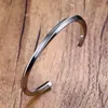 Brazalete de acero inoxidable vintage para hombres y mujeres Mobius Twisted Cuff Bracelet Unisex