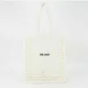 2022 Hot Ins Designer Brands Hollow Letters Rafia Straw Tote Fashion Paper Woven Women Shoulder Bags Summer Beach Borsa Borsa di lusso