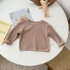 シャツ幼児の男の子の女の子ファッションワッフルソリッドTシャツ幼児の子供の綿服秋の春のカジュアルプルオーバートップ