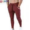 Pantalones de hombre Rainbowtouches 2022 Nueva moda Entrenamiento deportivo Correr Fitness Gimnasio Pantalones Hombres Múltiples bolsillos Sliod Color Lápiz Pantalones T220909