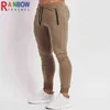 Calças masculinas RainbowTouches Autumn e Winter New Solid Color Sports Fitness Trouspers Training Running Men's Clothing Super Elastic Pants T220909