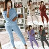 女性の2ピースパンツ2PC/セット秋の冬のニット衣装女性パンツスーツセクシーなワンセータースキニーセットトラックスーツ