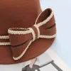 Basker imitation ull filt fedoras hattar fashionabla vintage hink hatt bred brim bowknot dekoration jazz varm kvinnlig bowler