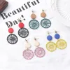 Boucles d'oreilles pendantes TKJ tempérament long pompon en bois femmes rétro créatif creux géométrique enroulement attrape-rêves