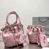 Sac seau Le Cagole XS SACS À épaule LE CAGOLE CROCODILE EN RELIEF DE STRASS noir rose Arena crossbody luxe Designers Sacs à main de moto en cuir véritable