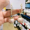 أنثى فاخرة كبيرة مستديرة طوق أزياء الأزياء الذهبية كواتير الزفاف الزورق الحجر Zircon Dangle Drop أقراط للنساء