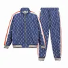 مصممي Luxurys للرجال للنساء Drees Fashion Tracksuits القصيرة الأكمام بنطلون جولة طوق الترتر التطريز الرياضة الرياضية 2 قطعة مجموعة S-XL