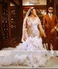 2022 Luxury Mermaid Wedding Dresses Bridal Gowns Plus Size Sexy Arabic Jewel Neck Illusion Long Sleeves Champagne Embroidery Lace Appliques Ruffles Tiered