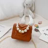 Bolso de mano con cadena de perlas para niñas, bolsos con hebillas de Metal para niños, por favor comprenda, bolso de cuero de un hombro, Mini Purese para mujer