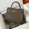 Designer Borse tote Borse Classico portatile Designer modello litchi Moda Togo Pelle di mucca Borsa versatile Borsa a spalla singola Fibbia da donna ftgy